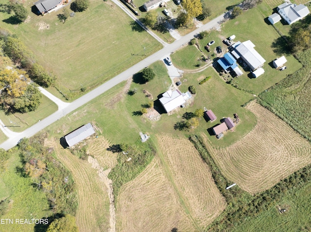 birds eye view of property with a rural view