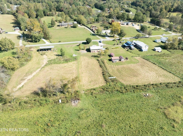 birds eye view of property featuring a rural view