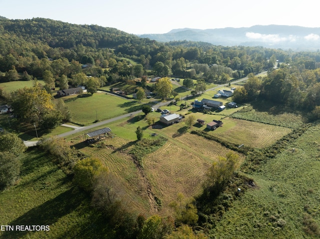 birds eye view of property with a rural view