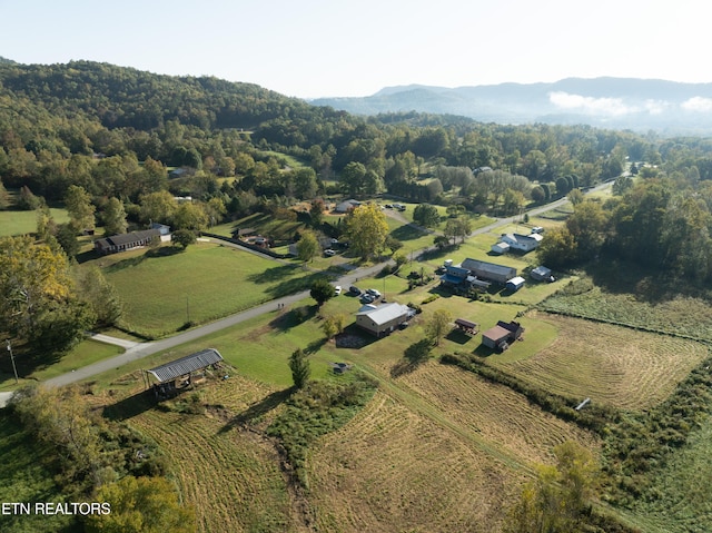 birds eye view of property with a rural view