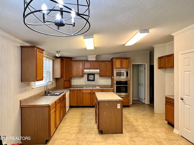 kitchen with sink, a kitchen island, decorative light fixtures, stainless steel appliances, and vaulted ceiling