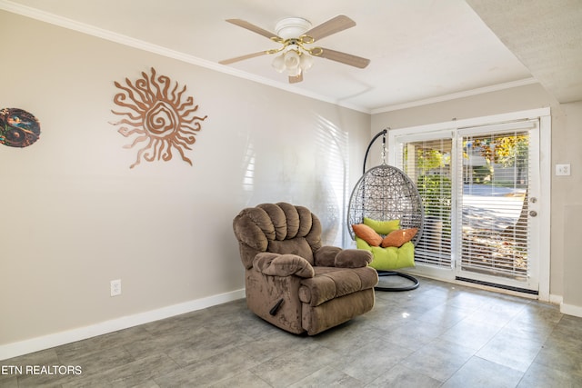 living area featuring crown molding and ceiling fan