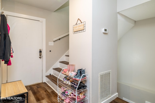 mudroom with dark hardwood / wood-style floors