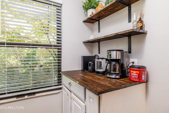 bar with white cabinetry