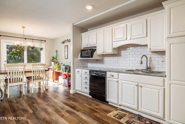 kitchen featuring black appliances, sink, dark hardwood / wood-style flooring, decorative light fixtures, and white cabinets