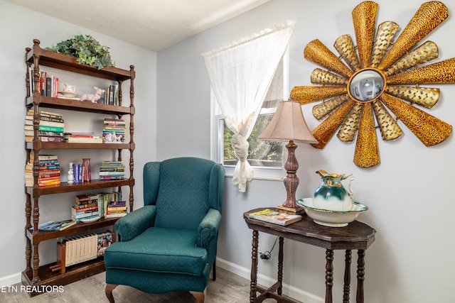 living area with light hardwood / wood-style flooring