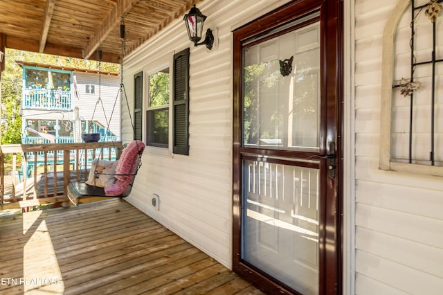 wooden terrace with a porch