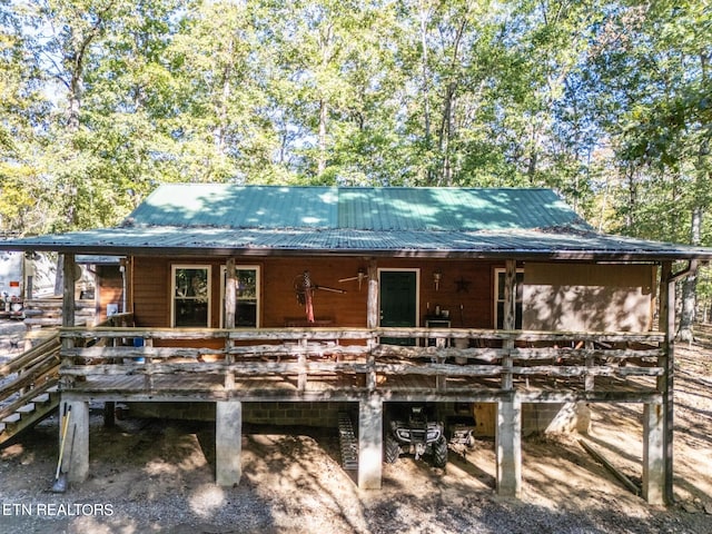 rear view of property with a deck