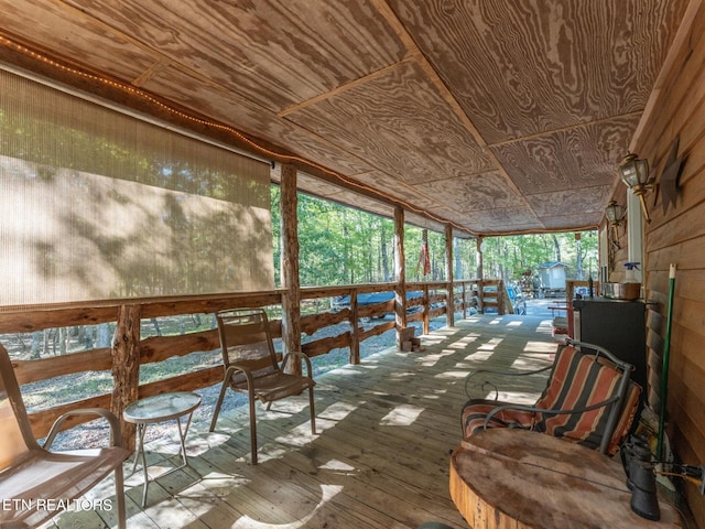 interior space with a wealth of natural light and wooden ceiling