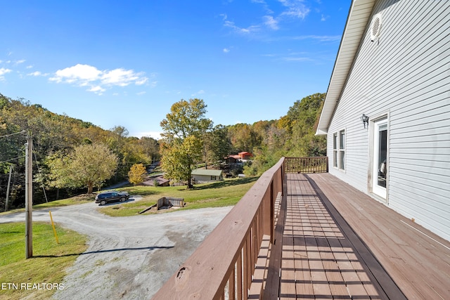 deck featuring a lawn