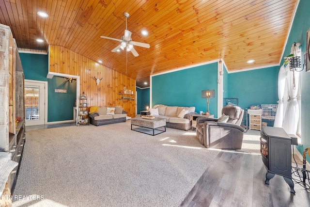 living room featuring wood walls, hardwood / wood-style floors, wooden ceiling, and ceiling fan