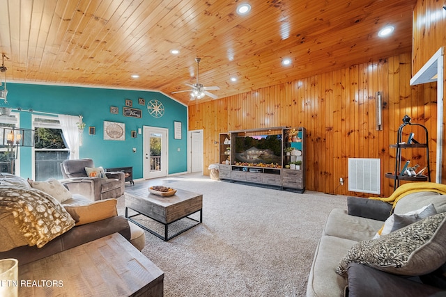 carpeted living room featuring wood ceiling, lofted ceiling, wooden walls, and ceiling fan