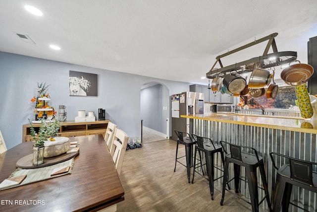 dining area with light hardwood / wood-style flooring