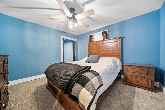 bedroom with light colored carpet and ceiling fan