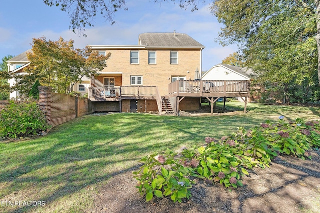 rear view of property featuring a deck and a lawn