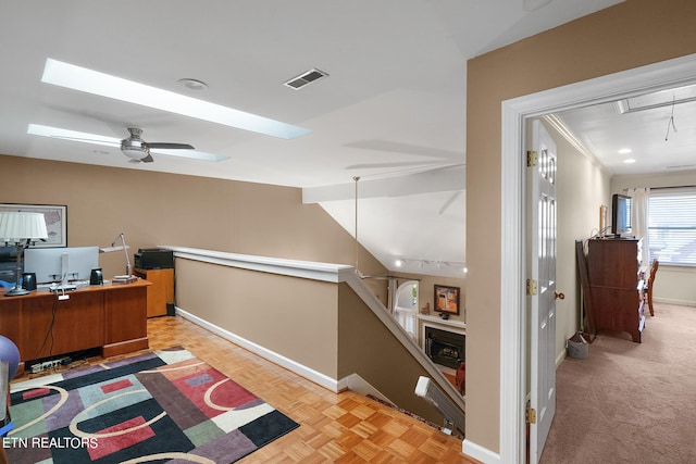 office area featuring ceiling fan, light parquet flooring, vaulted ceiling, and crown molding