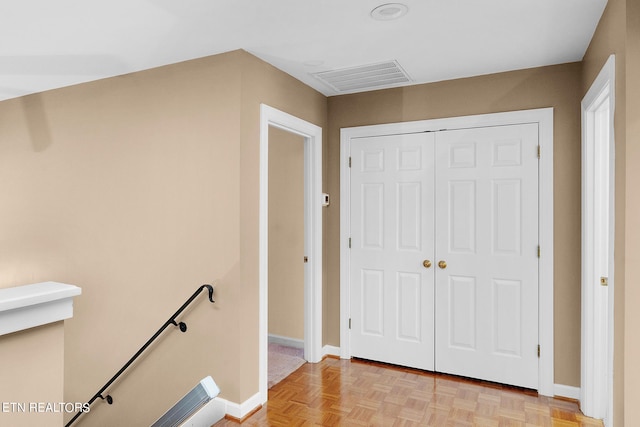 hallway with light parquet floors