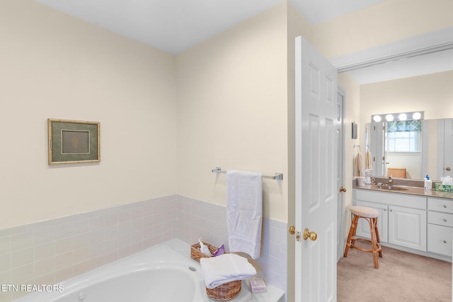 bathroom with vanity and a bath