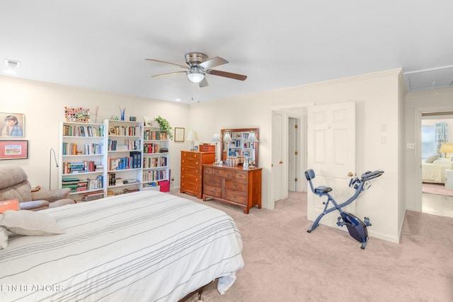 bedroom featuring ornamental molding, light colored carpet, and ceiling fan