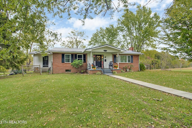 ranch-style home featuring a front yard and a porch