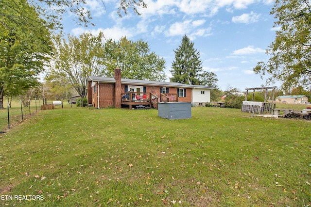 exterior space with a deck and a yard