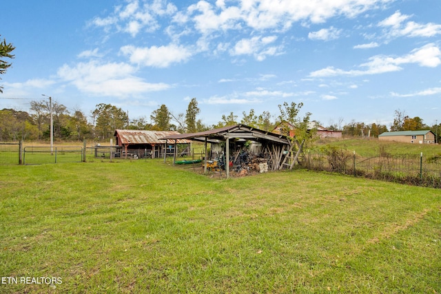 view of yard with a rural view