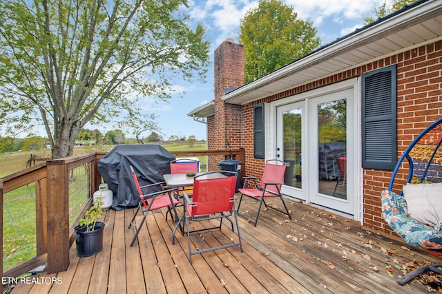 wooden deck with grilling area