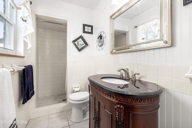 7338 Palmleaf Rd, Knoxville, TN 37918 - bathroom with tile walls, tile patterned flooring, toilet, a shower stall, and vanity