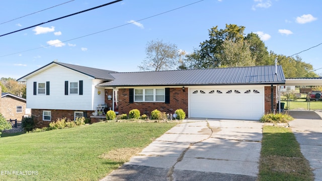 view of front of property with a front yard and a garage