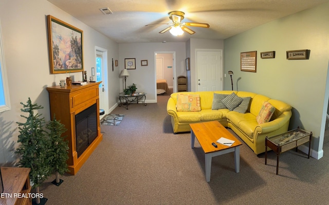 240 Mariner Point Rd, Lafollette, TN 37766 - carpeted living room with visible vents, a glass covered fireplace, ceiling fan, and baseboards