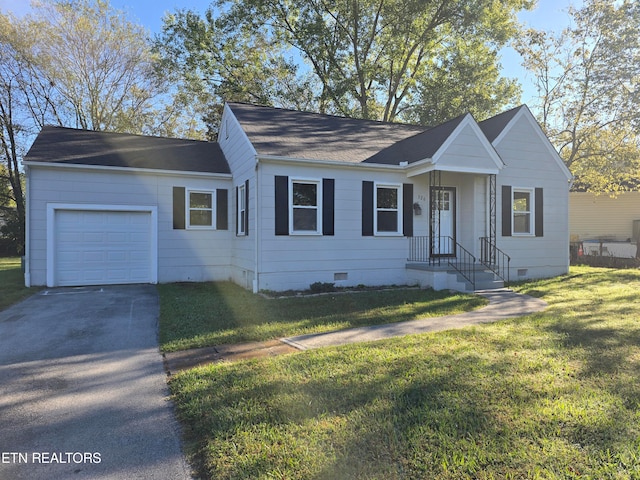 ranch-style home featuring a front yard and a garage