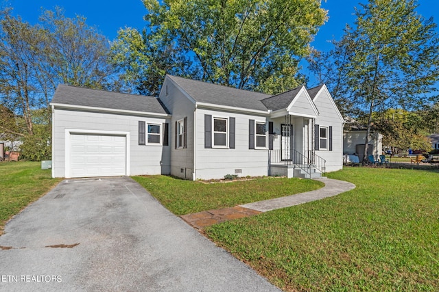 view of front facade featuring a front lawn and a garage