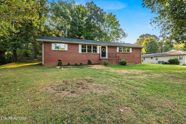 ranch-style home with a front yard