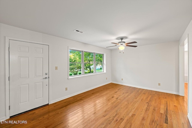 spare room with light hardwood / wood-style flooring and ceiling fan