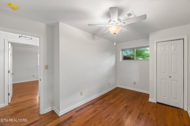 unfurnished bedroom with a closet, ceiling fan, and hardwood / wood-style floors