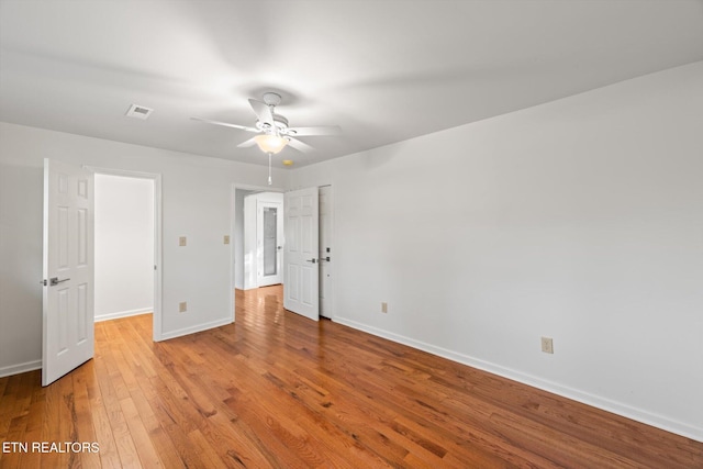 unfurnished bedroom with ceiling fan and light hardwood / wood-style flooring