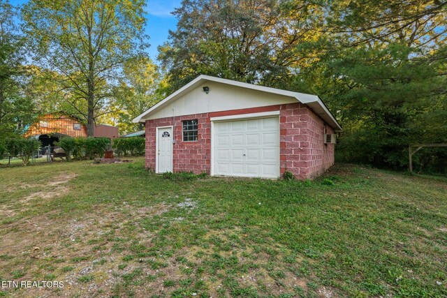 garage featuring a yard