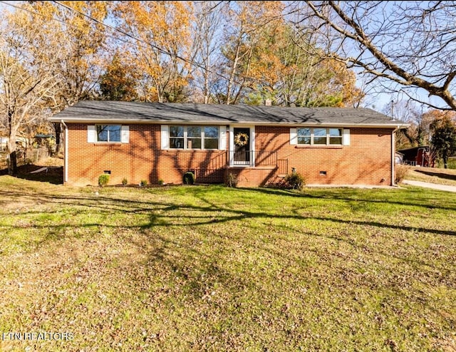 ranch-style home with a front lawn