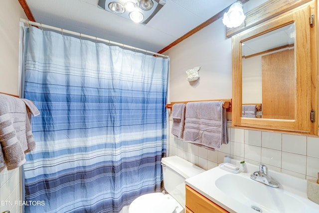 bathroom featuring backsplash, toilet, walk in shower, vanity, and ornamental molding