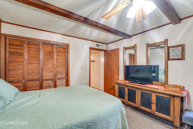 carpeted bedroom featuring ornamental molding, a textured ceiling, beamed ceiling, and ceiling fan