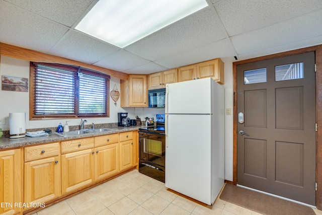 kitchen with light brown cabinets, sink, black appliances, light tile patterned flooring, and a paneled ceiling