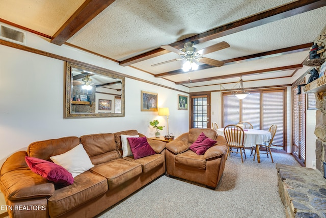 carpeted living room featuring beam ceiling, a textured ceiling, and ceiling fan