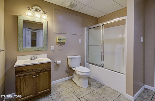 full bathroom with shower / bath combination with glass door, tile patterned floors, vanity, and toilet