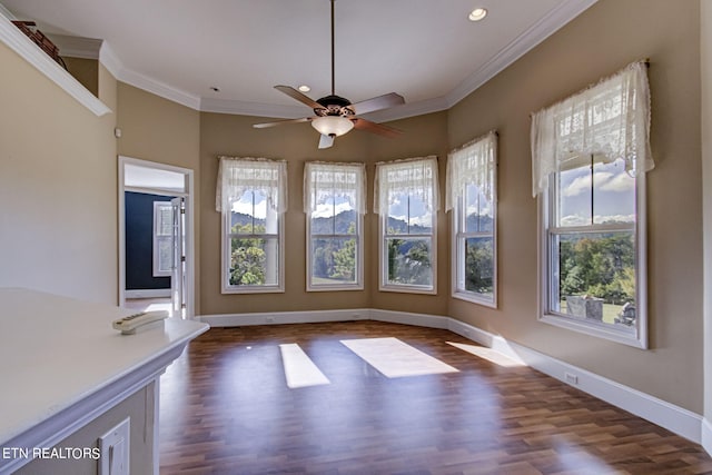 interior space featuring ceiling fan, dark hardwood / wood-style floors, and ornamental molding