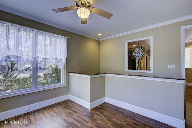 spare room with hardwood / wood-style flooring, ceiling fan, and ornamental molding