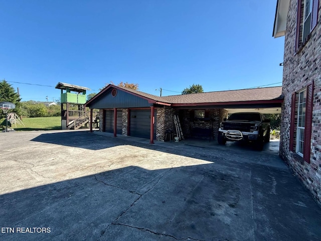 exterior space with brick siding, concrete driveway, and a carport