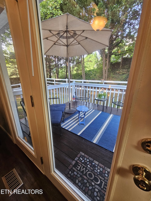 doorway featuring dark hardwood / wood-style floors