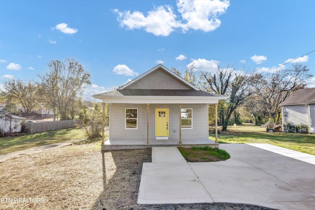 bungalow featuring a front yard and a porch