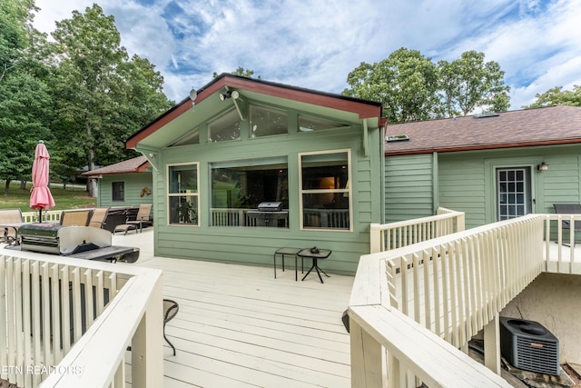 deck featuring central air condition unit