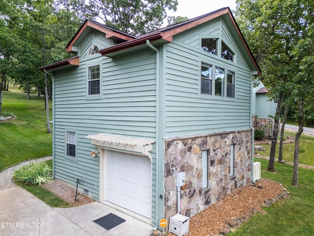 view of side of property with a yard